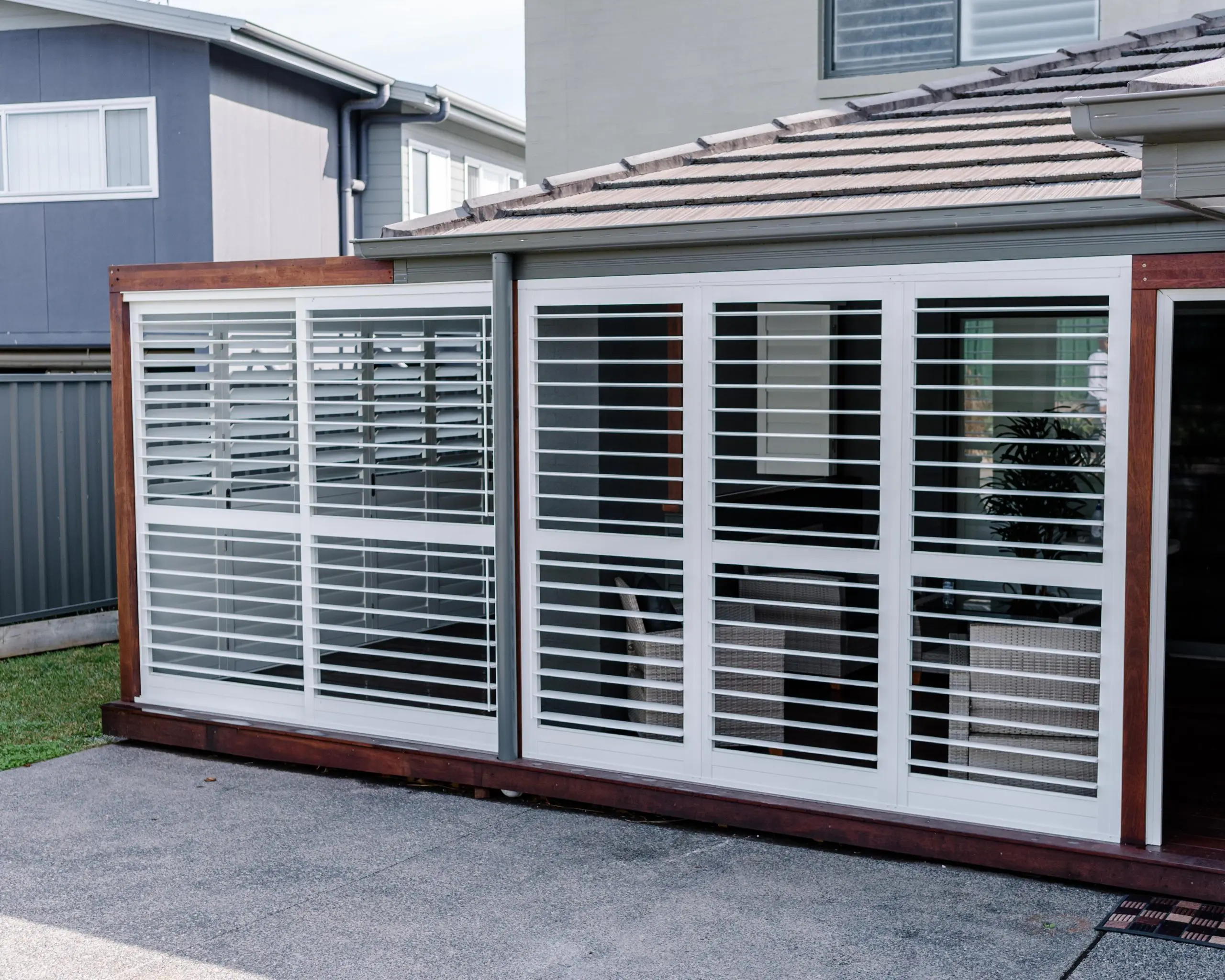 Australian Plantation Shutters installed white outdoor sliding shutters
