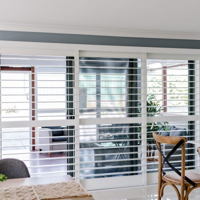 White sliding door plantation shutters designed by Australian Plantation Shutters