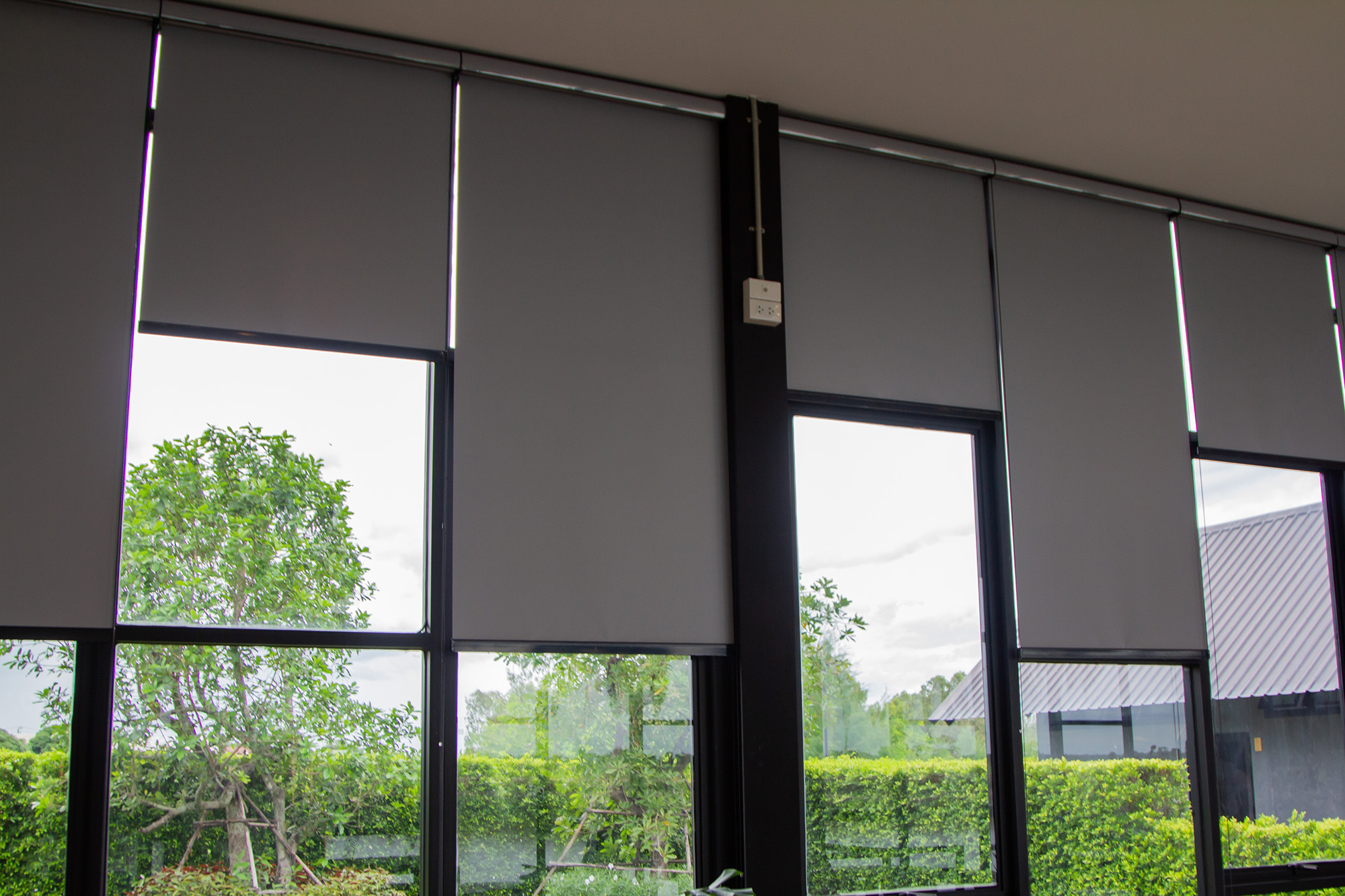 Grey Roller Blinds on Large Windows installed by Australian Plantation Shutters