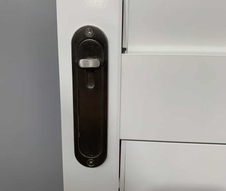 Close-up of silver lock on white shutter installed by Australian Plantation Shutters