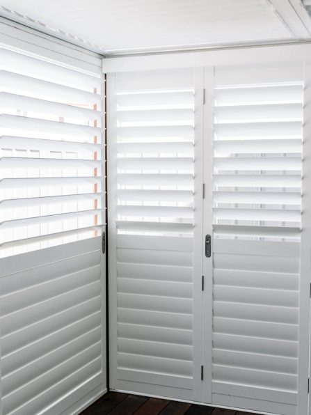locked bifold white shutter doors by Australian Plantation Shutters